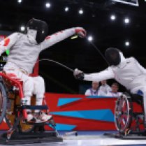 LONDON, ENGLAND - SEPTEMBER 08: Daoliang Hu of China (L) competes against Alim Latrech (R) of France during the Men's Team Catagory Open Wheelchair Fencing Final on day 10 of the London 2012 Paralympic Games at ExCel on September 8, 2012 in London, England. China won the match securing a Gold Medal. (Photo by Dan Kitwood/Getty Images)